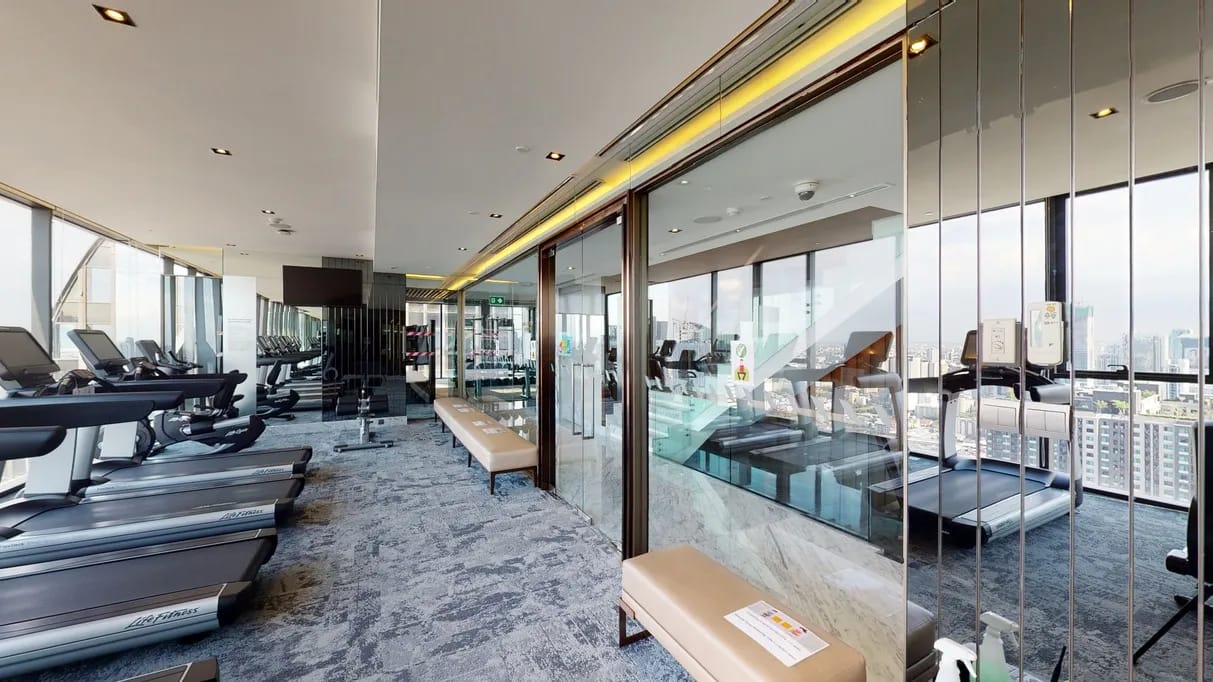Fitness centre with city views at The Esse at Singha Complex