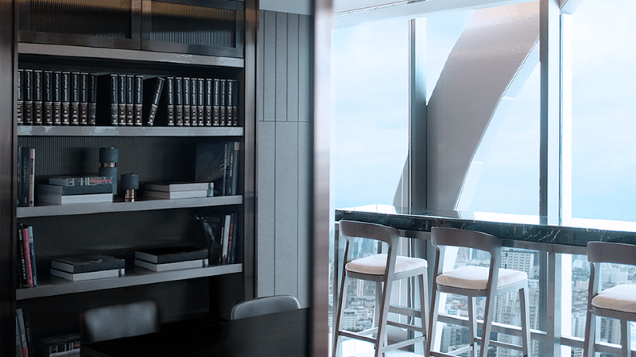 Library and window-side seating at The Esse at Singha Complex