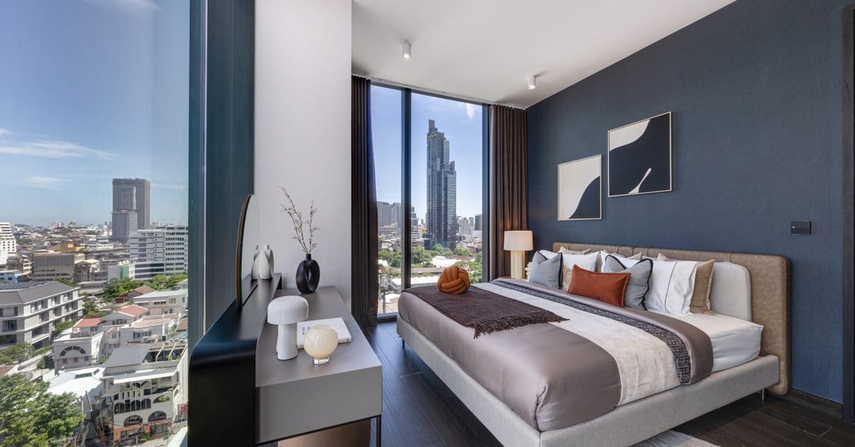 Corner bedroom with full-height glazing at Tait Sathorn 12